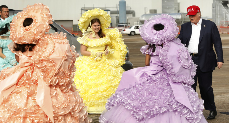 U.S. President-elect Donald Trump greets a group of gathered Azalea Trail Maids as he arrives for a stop on his USA Thank You Tour event in Mobile, Alabama